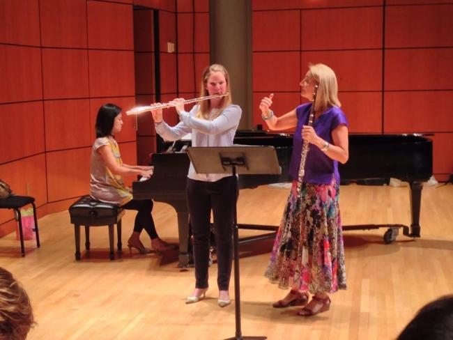 Carol Wincenc, professor of flute at The Juilliard School, instructs a student during Flutissimo 2014 in Ramsey Concert Hall.