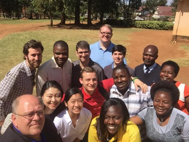 UGA faculty and students, led by Dr. Skip Taylor (bottom left) and Dr. Pete Jutras (third row, third from left), share a photo with faculty and staff of Potters House Elementary School in Kenya.