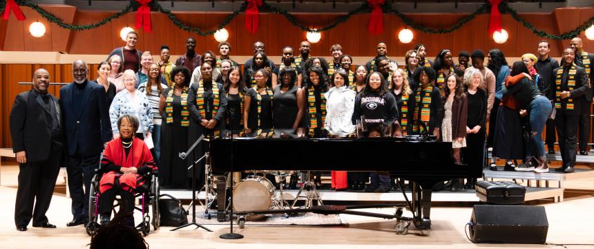 Gregory Broughton (far left), George Miller, III and Pastor Nawanna Lewis Miller, along with current and former AACE singers, including Subrena Clark (center) following the AACE concert on Monday, November 25, 2024.