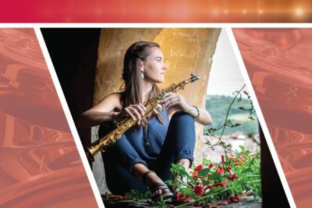 Caroline Halleck sitting with flowers holding a saxophone