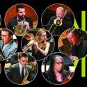 Nine faculty performers shown in performance over a black background with a green spark.